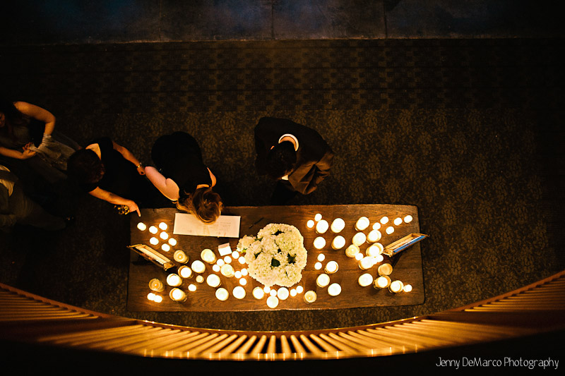 Wedding guests arrive at the Smith Family Chapel in Austin Tx. Sign in table is covered in romantic candel light.