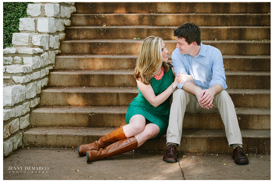 Couple sitting on the steps at a Ladybird Lake engagement session.