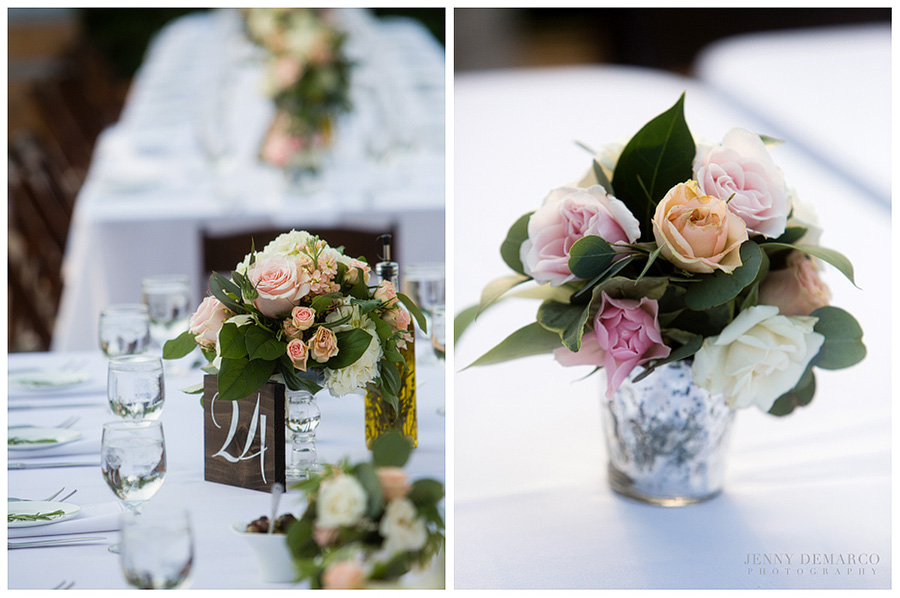 Shelby and Chad's reception decor featuring their earthy blush romantic tones in their flowers on the connected banquet tables at the venue. 