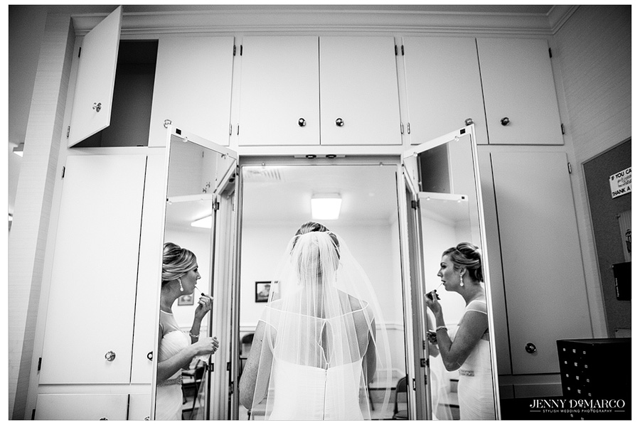 Black and white shot of beautiful bride getting ready for her wedding.