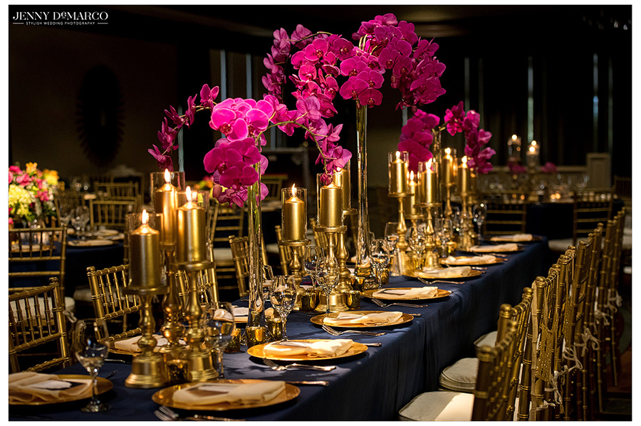 Glamorous and modern wedding reception with gold and fuchsia detailing.