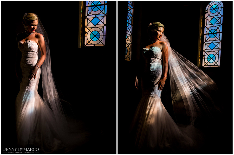 Lit up by the beautiful colors of a stained glass window, the bride calmly waits to walk down the aisle.