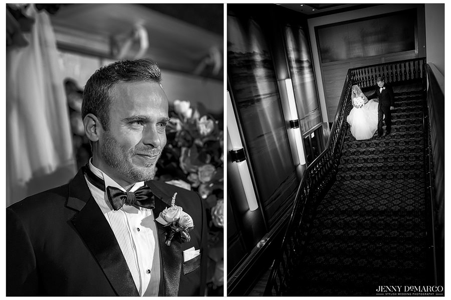 The groom waits anxiously as the bride and her father walk down the staircase to meet him.