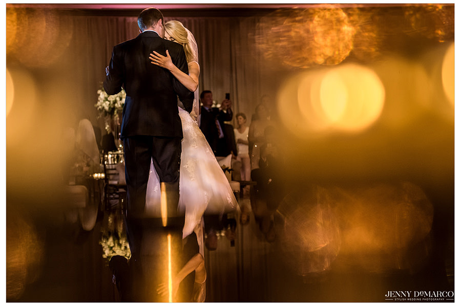 The bride and groom share a sweet moment during their first dance.