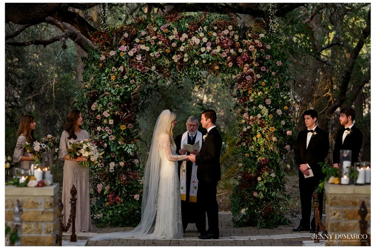 Bride and groom looking at each other at the altar