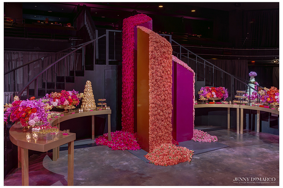 The different finger food and snack options still look fancy displayed next to the three towers of flowers and gold accents.