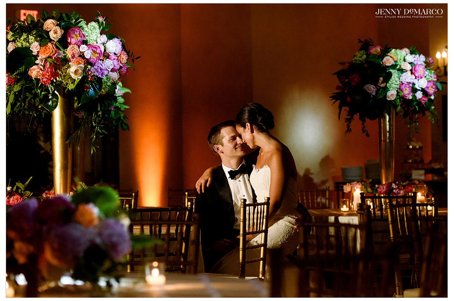 Bride and Groom have an intimate moment in beautiful reception ballroom
