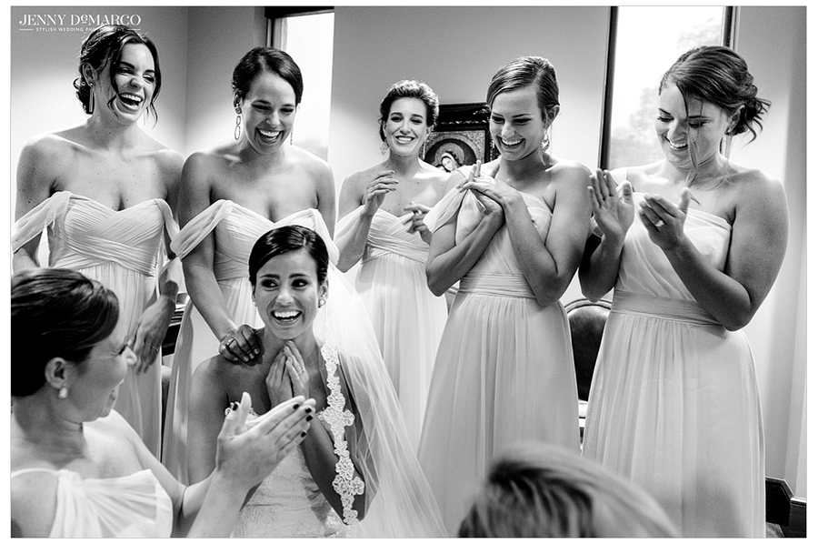 Bride and her bridesmaids happy after praying, black and white photo