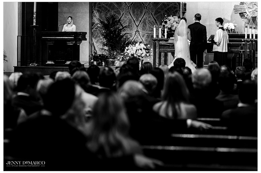 View of bride and groom from the back of the pews