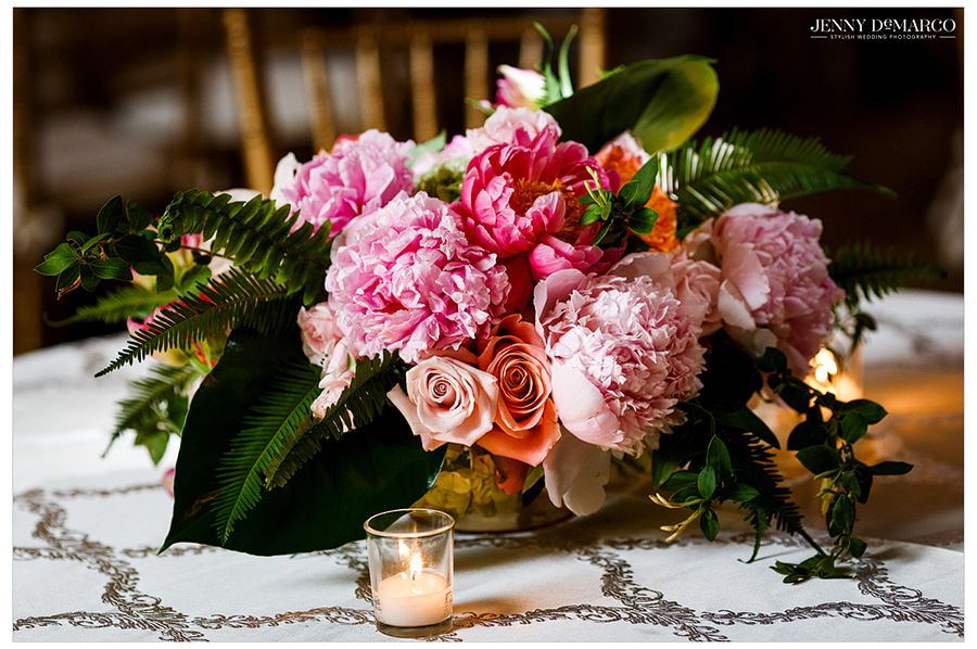 Detailed view of pink flower centerpiece on table 