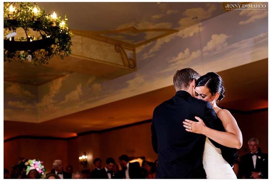 Bride and Groom hug as they share a slow, first dance