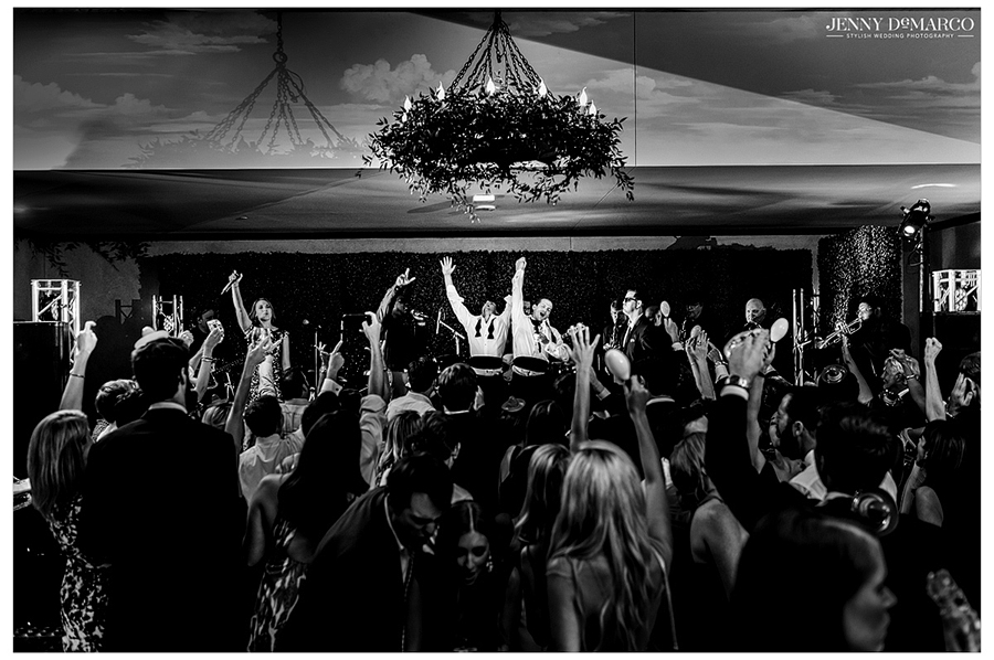 Black and white photo of reception party including guests 