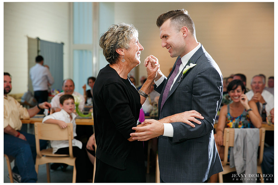 The groom dances with his mother.