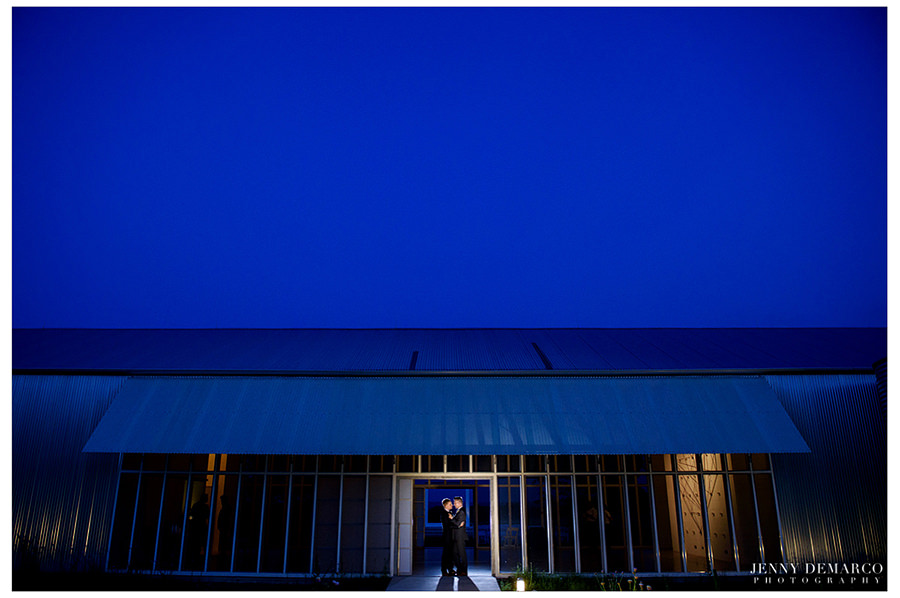 A very blue night portrait of the grooms after their wedding.