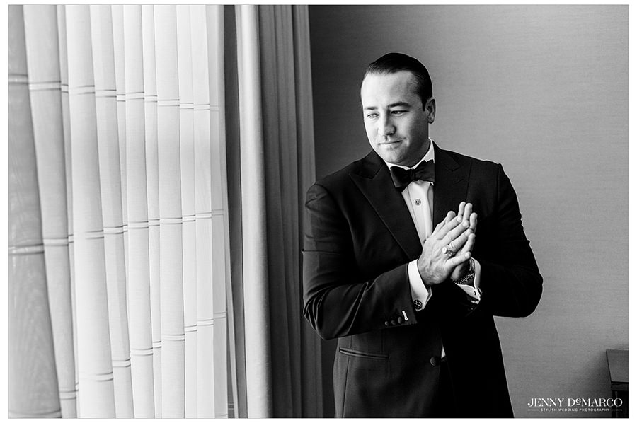 A black and white solo-shot of the groom.