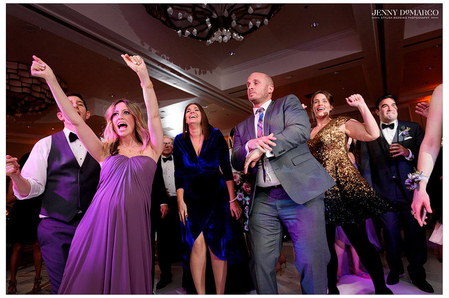 Guests singing and dancing on the ballroom dance floor a the Four Season's Hotel.