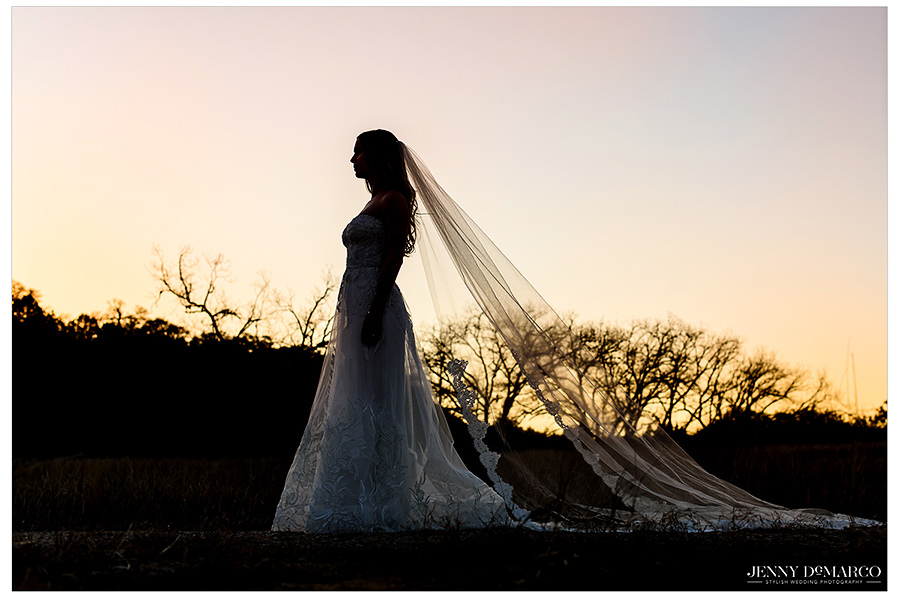A sunset silhouette of the bride.