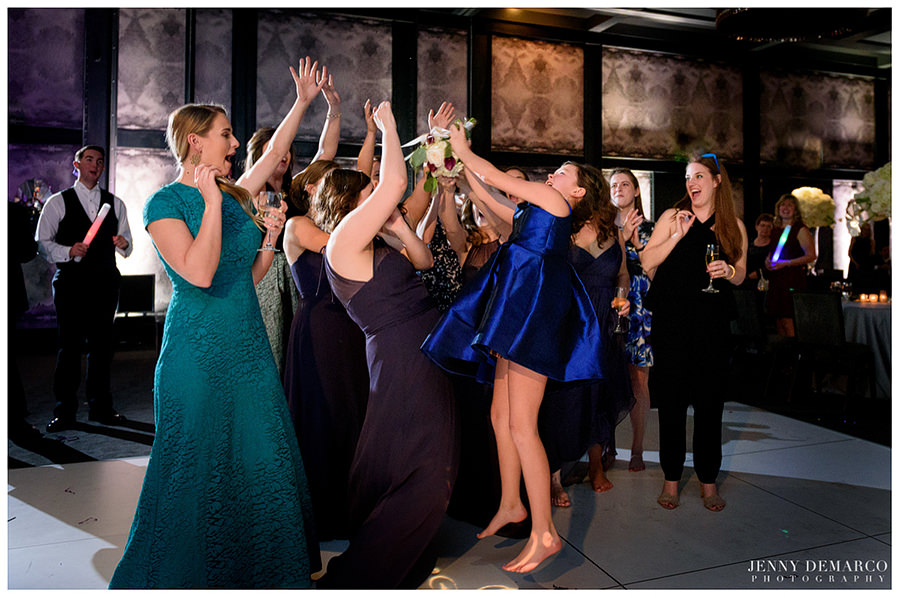 Tossing of the bouquet at wedding reception at hotel Van Zandt