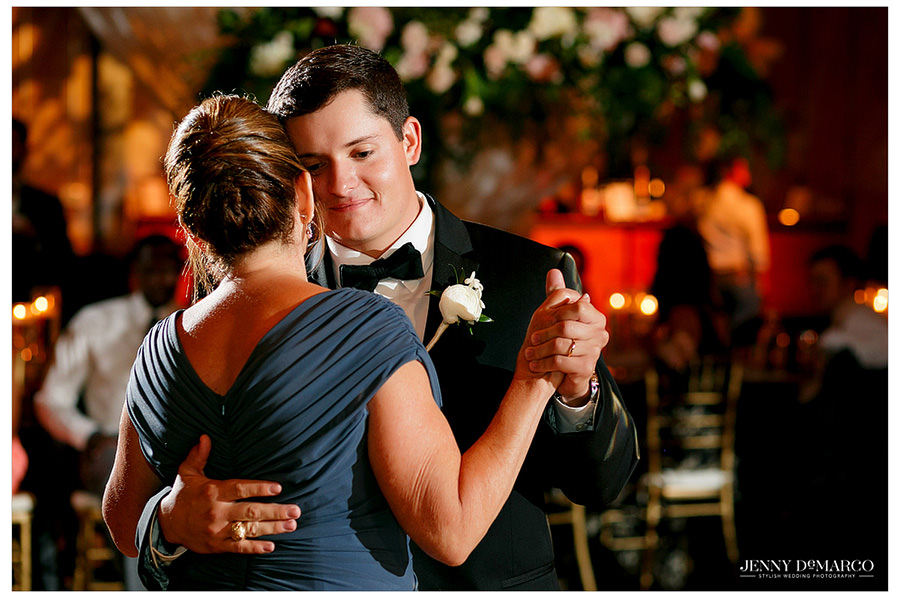 Groom dances with his mother at the wedding reception