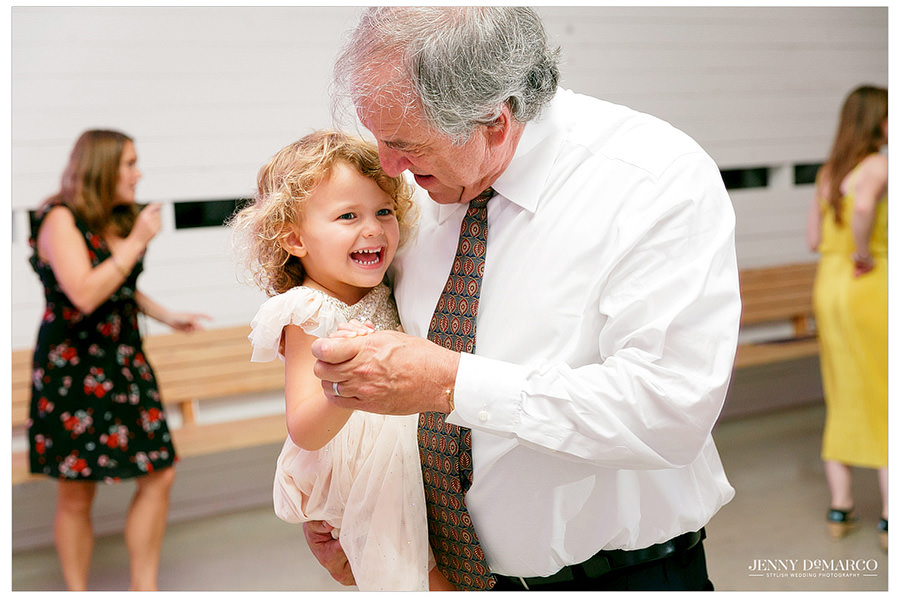 Father of bride dances with his granddaughter