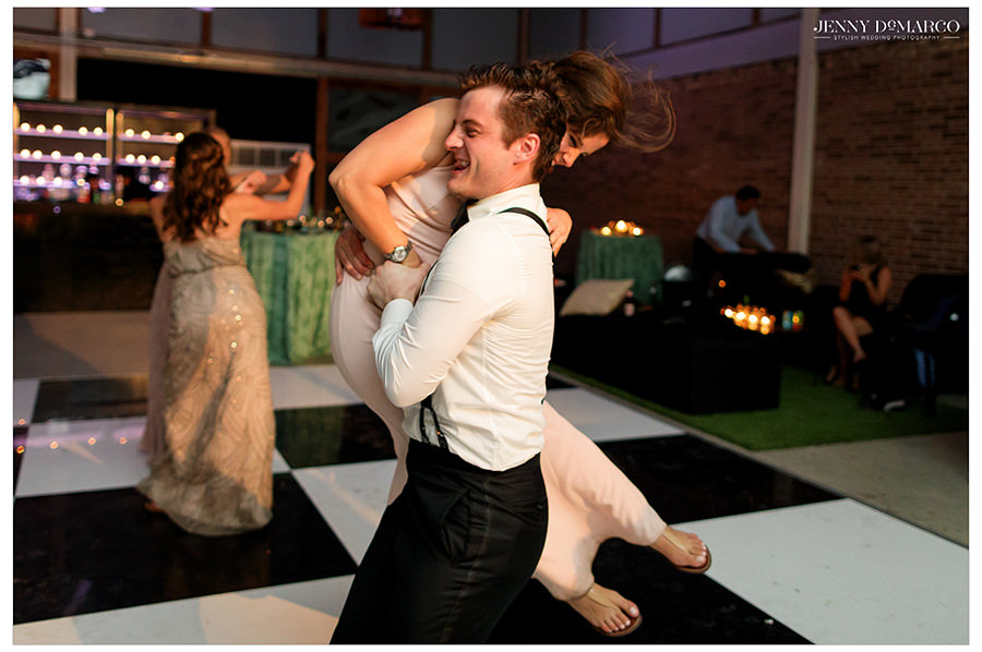 a fun moment is shared in the reception at the barr mansion