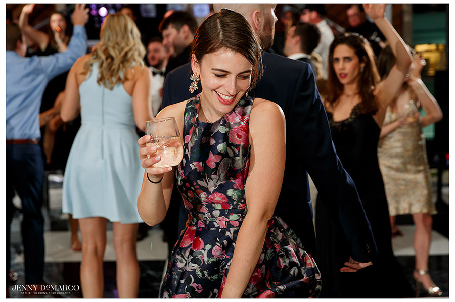 party guests dance in fun and playful wedding shot