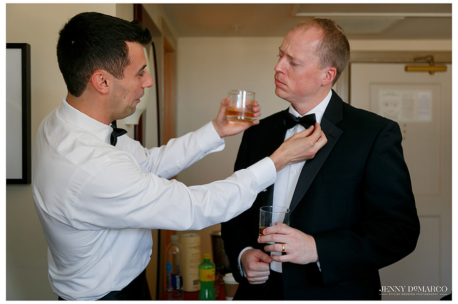 groomsmen helping to fix each other's bowties
