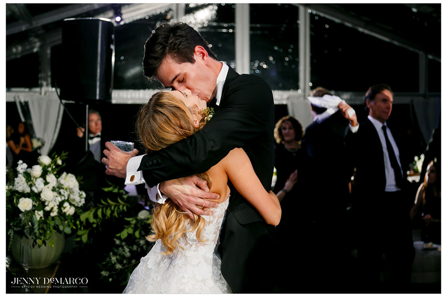 Bride and groom share a kiss in the hill country of driftwood texas