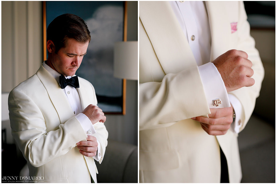 The groom excitedly adds the finishing touches to his suit.