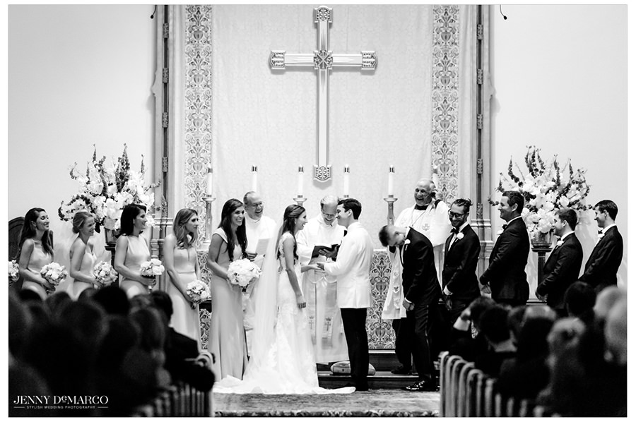 Jackie and Hunter stand at the altar in front of all of their friends and family. 
