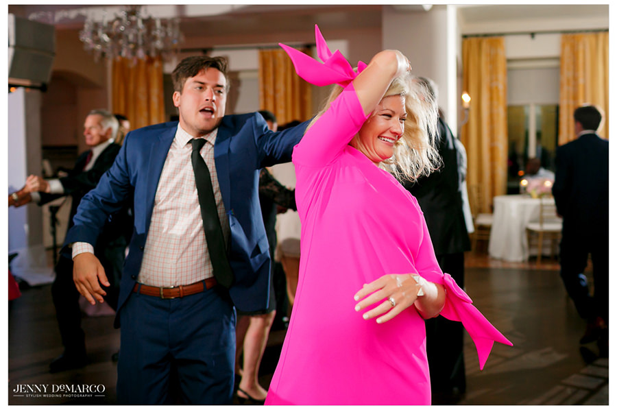 Guests take the dance floor and give their dates a twirl.