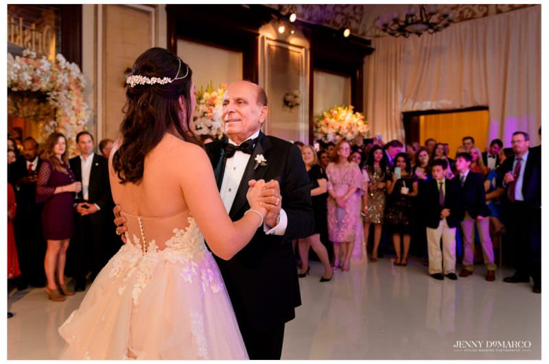 The bride dances with her father.