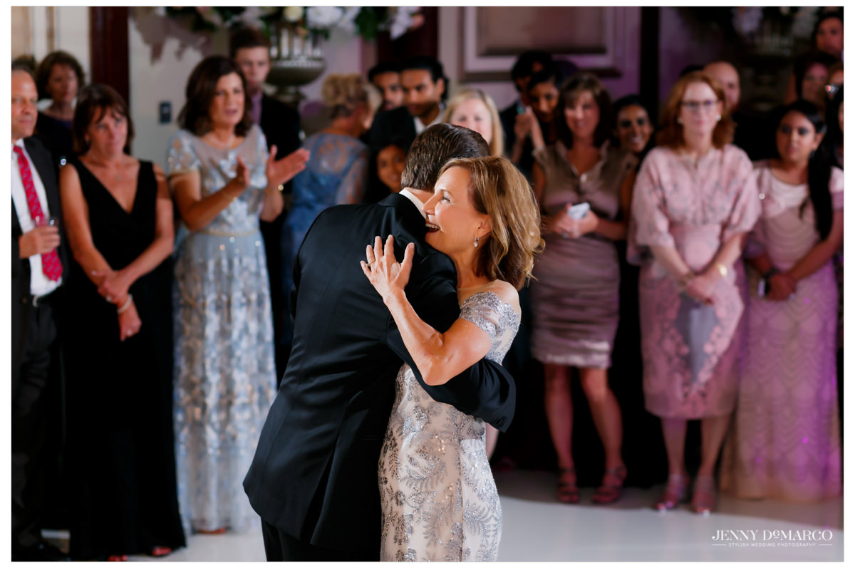 The groom dances with his mom.