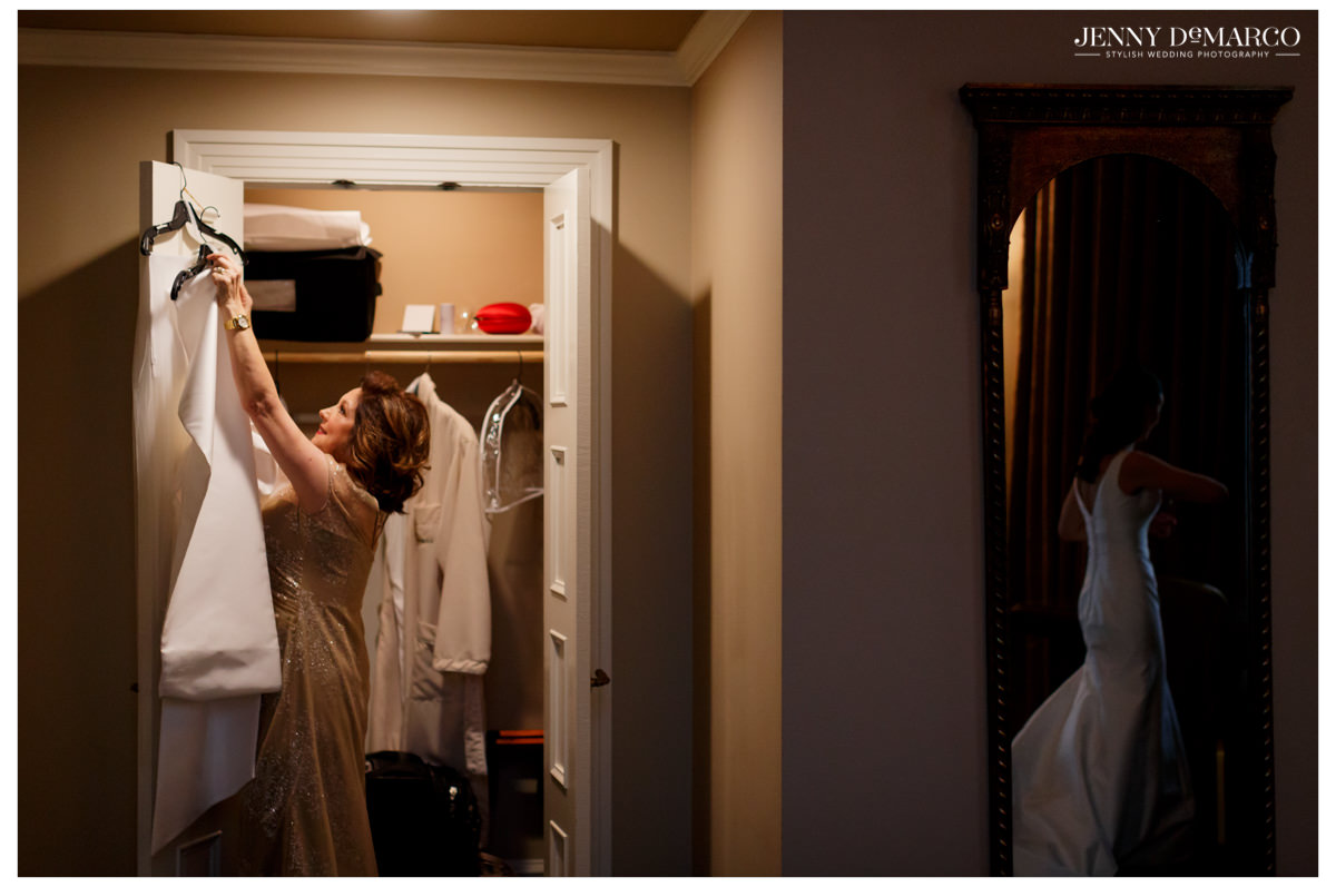 Mother of the bride helps with the wedding dress.