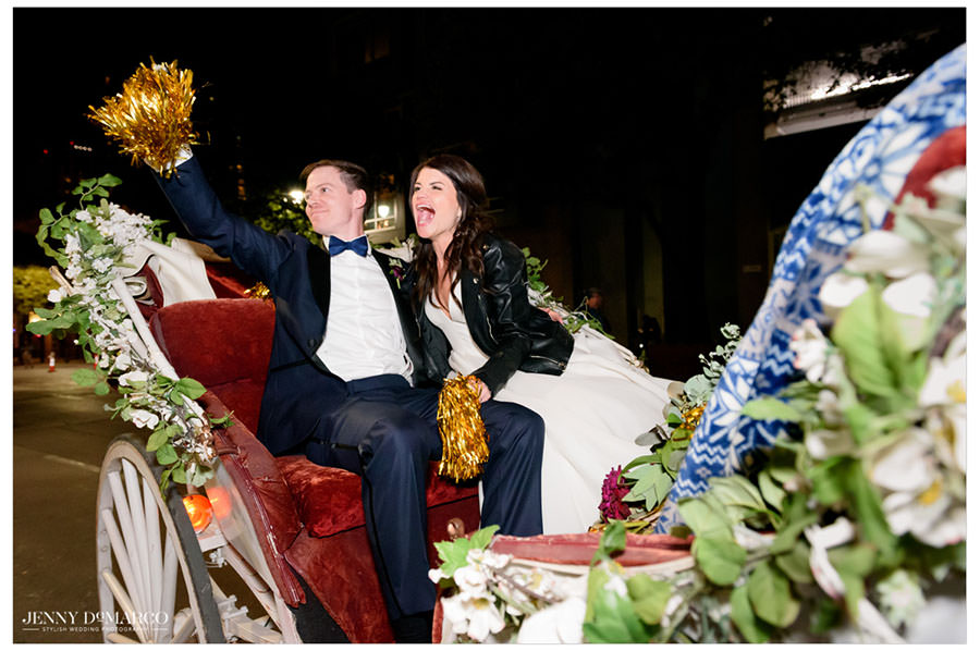 bride and groom leaving the reception in a carriage 