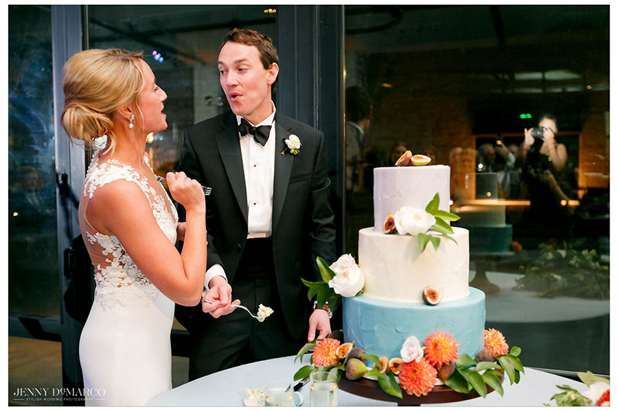 Bride and groom eating their wedding cake. 