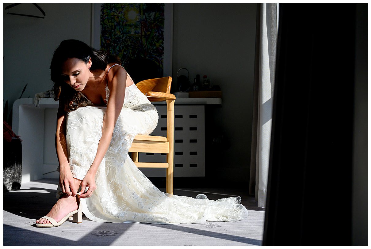 bride putting on her shoes 