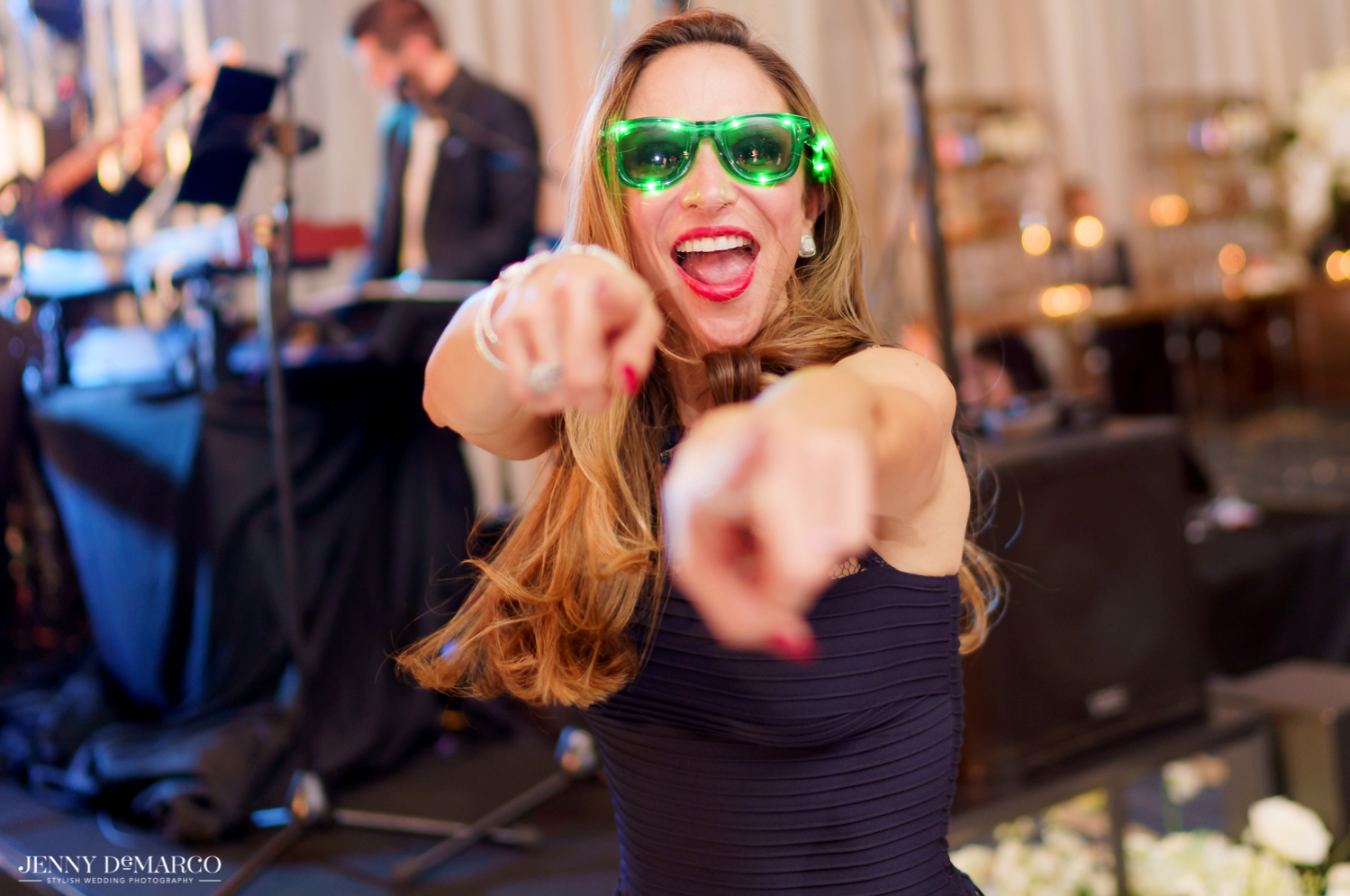 guests dancing at the wedding reception with fun sunglasses on