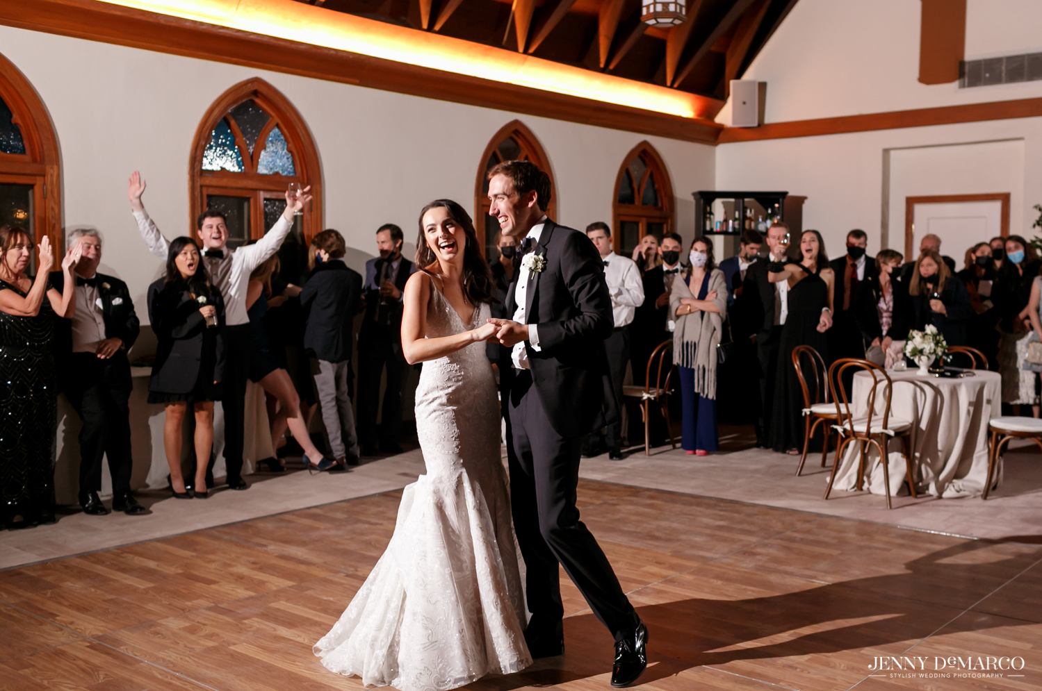 bride and groom laughing during their first dance together 