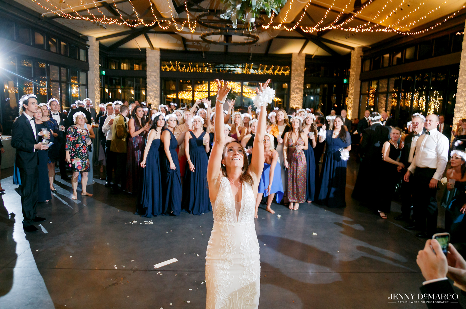 Bride throws flower bouquet to all the single ladies
