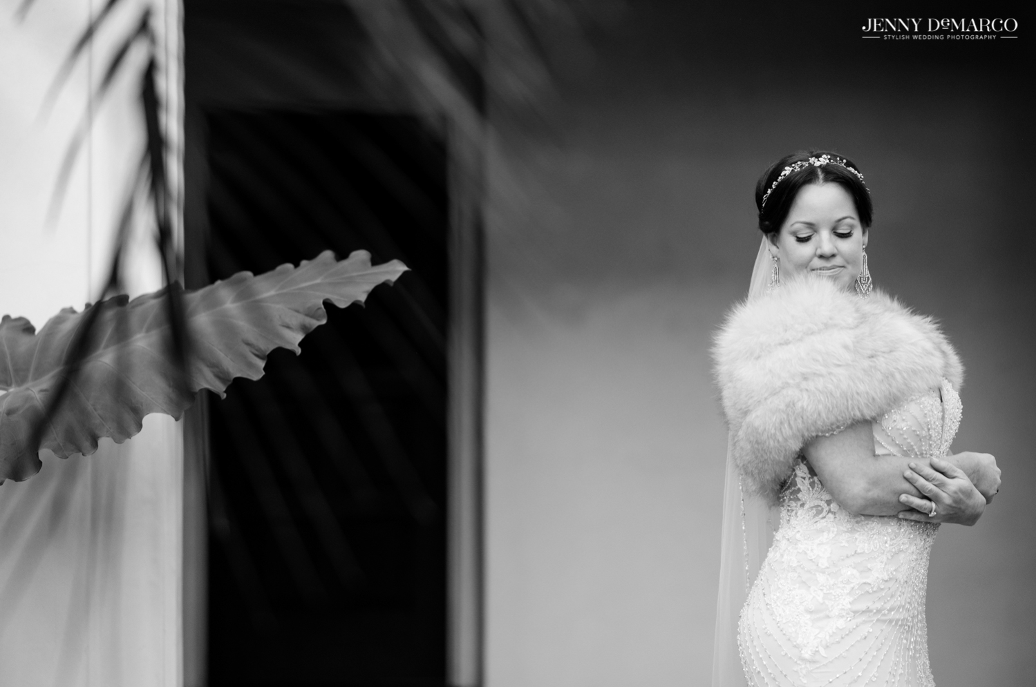 bride in her fur wrap and lace wedding dress