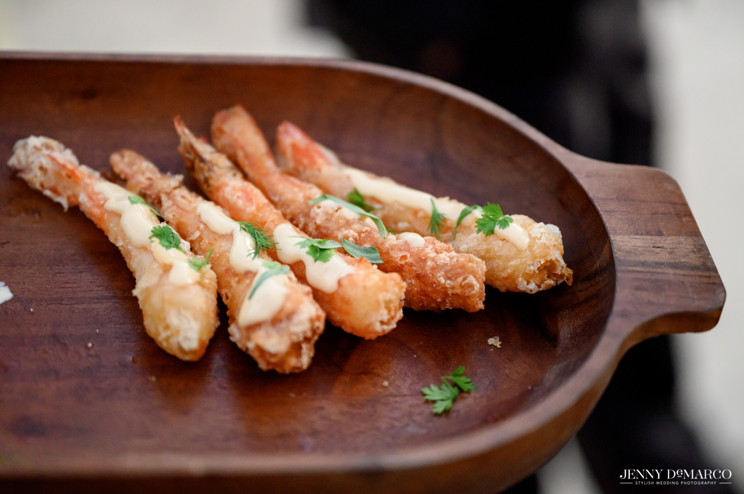 shrimp appetizers on a wooden plate 