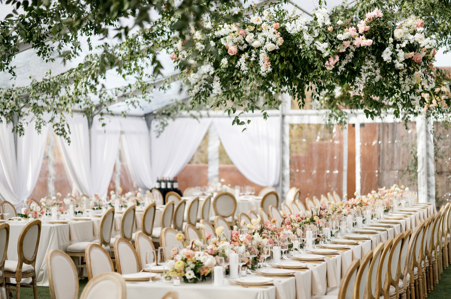 stunning greenery and white and pastel florals in the reception tent 