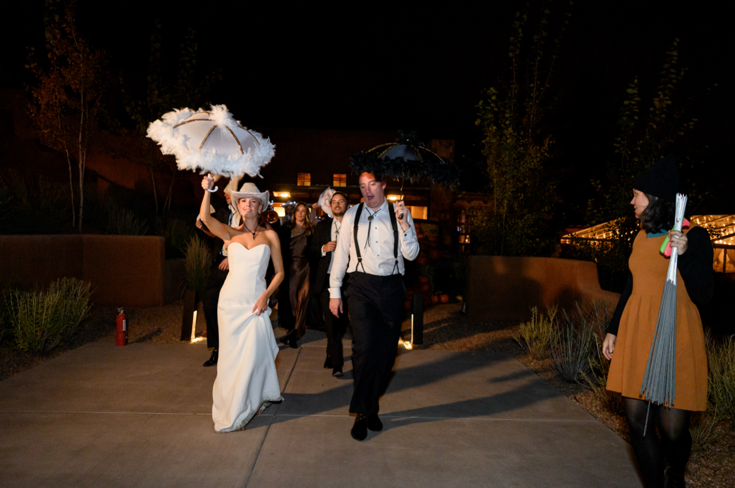 bride and groom exiting the wedding reception 