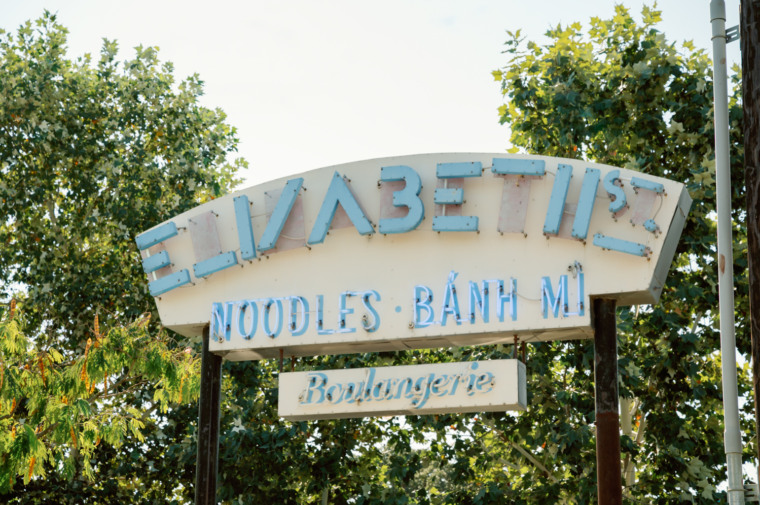 The Elizabeth Street Cafe Sign in Austin, Texas. The sign advertises "noodles, bahn mi, boulangerie"