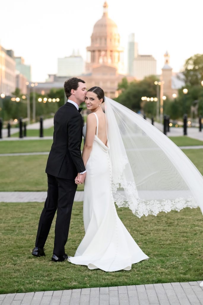 bride and groom portraits in front of the Texas Capitol