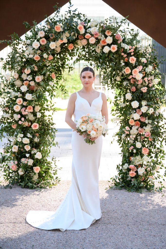 bridal portrait in front of the floral altar
