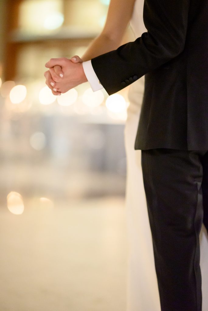 bride and groom's hands during first dance