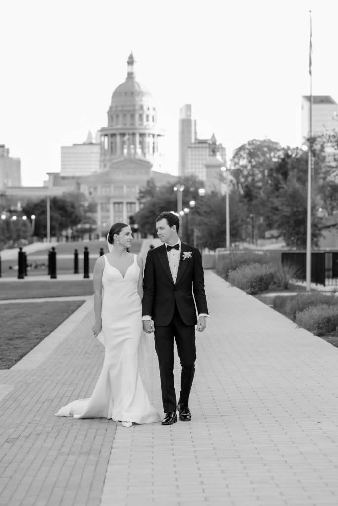 bride and groom portraits in front of the Texas Capitol building