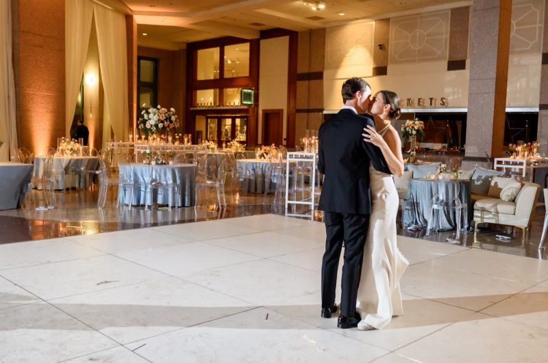 bride and groom kissing during last dance